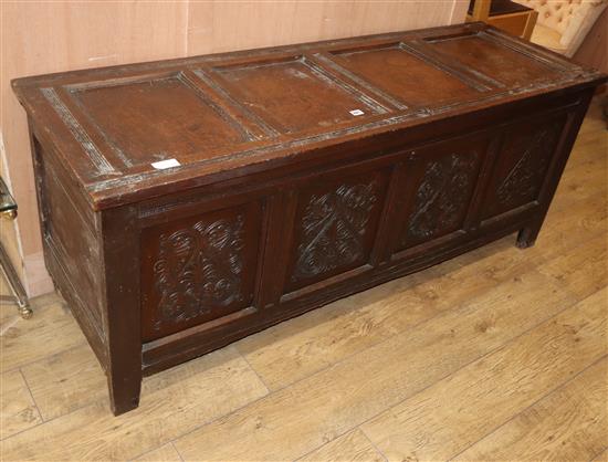 A 17th century panelled oak coffer W.165cm